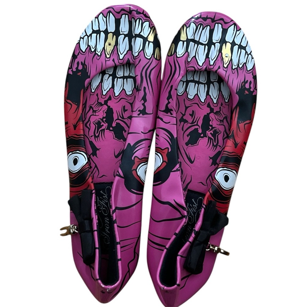 Iron fist pink ballerina skull slippers with gold tooth and bow details